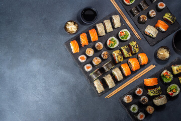 Wall Mural - Sushi set on dark slate background