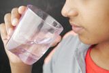 Fototapeta Łazienka - teenage boy drinking water close up 