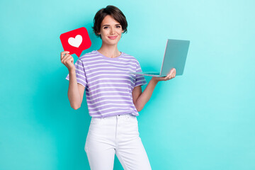 Sticker - Photo of positive lady hold red paper heart card enjoy using new gadget recommend netbook empty space isolated on cyan color background