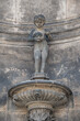 Old sculpture of a bathing child and shell at the fountain in historical and museums downtown of Dresden