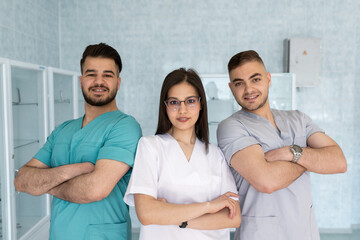 Wall Mural - Group of medical staff smiling at the hospital.