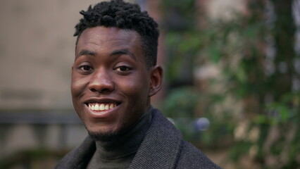 Happy satisfied black African portrait face close-up smile