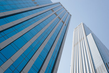 Exterior view of two skyscrapers, low angle view. 