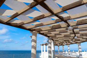 wood pergola for sun protection on the beach