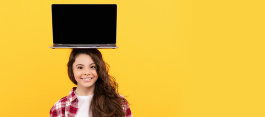 Canvas Print - happy smart teen girl with laptop on head presenting school online lesson. School girl portrait with laptop, horizontal poster. Banner header with copy space.