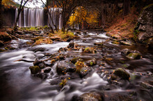 Waterfall And Creek In A Beautiful Autumn Day