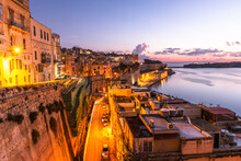 Valletta, Malta - The Traditional Houses And Walls Of Valletta Grand Harbour At Sunrise
