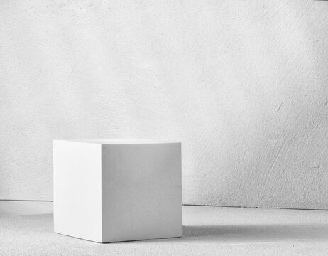 Fototapete - Gray cube on a concrete background. Background for product presentation