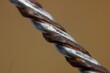 Closeup of copper wire texture on brown background