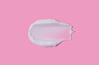 White cream smudge swatch textured on pink background

