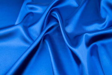 Wall Mural - Blue satin or silk fabric as background