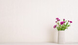 Fototapeta Tulipany - Garden chrysanthemum in concrete vase on white wooden desktop with copy space.