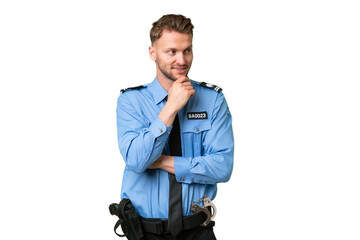 Wall Mural - Young police man over isolated background looking to the side