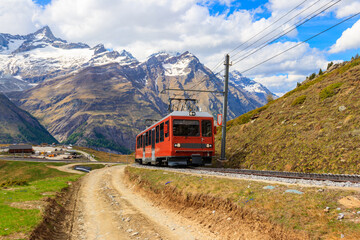 Beautiful view of the Swiss Alps with cogwheel train of Gornergrat railway close to Zermatt, Switzerland