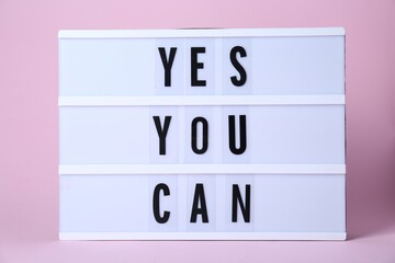 Wall Mural - Lightbox with phrase Yes You Can on pink background. Motivational quote