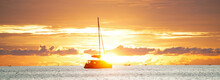 Sailboat And Long Boats At Sea. Seascape During Golden Sunset . Nature . Thailand,