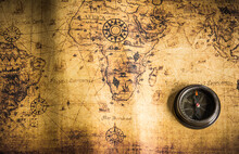 Old Vintage Retro Compass On Ancient Map.The Map Used For Background Is In Public Domain.