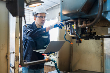 Aufkleber - Male engineer worker working with laptop computer for control machine in the workshop. Male worker working with lathe machine with safety uniform, goggles and helmet in the industry factory