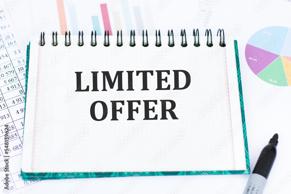 Limited Offer Description Example limited offer text written on notepad on the table against the ...