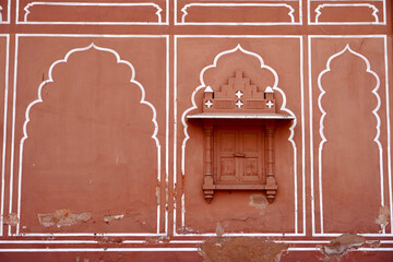 Wall Mural - Multiple rooms in city palace, Jaipur, India. Exterior view of palace rooms in pattern with closed windows. Symmetry rooms.