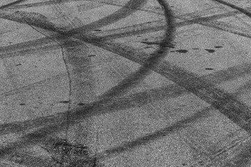 Wall Mural - Tire tracks texture and background, Asphalt texture with line and tire marks, Automobile automotive tire skid mark on race track, Abstract texture car drift tire skid mark.