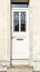 Wall Mural - door white wooden ancient home access restored of city house street facade