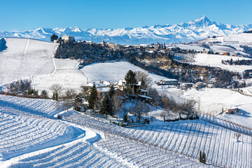 Wall Mural - Houses on the hills covered in snow in Italy.