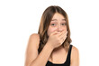 © vladimirfloyd - Shocked Embarrassed Young Woman Covering Mouth On A White Background
