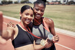 © L Ismail/peopleimages.com - Fitness, selfie and runner girls with medal celebrate winning success at running event at stadium. Sports, friends and support, happy winner women with smile taking picture together on track in sun.