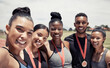 © L Ismail/peopleimages.com - Women, man and running track team with medals in fitness, workout or training marathon, sprint event or competition race. Portrait, happy smile or winner runners with sports award or exercise prize