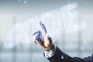 Wall Mural - man hand clicks on code word hologram on blurred office background, artificial intelligence and neur