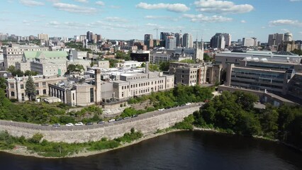 Sticker - Drone flying over downtown Ottawa with residential buildings near lake surrounded by lush greenery