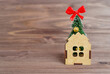 © Katie Chizhevskaya - Christmas tree in a toy house on a wooden table