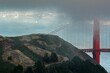 Breathtaking aerial view of dark clouds covering the Golden Gate Bridge in San Francisco, California