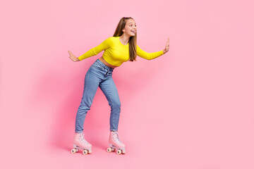 Sticker - Full length photo of charming excited school girl dressed yellow crop top riding rollers empty space isolated pink color background