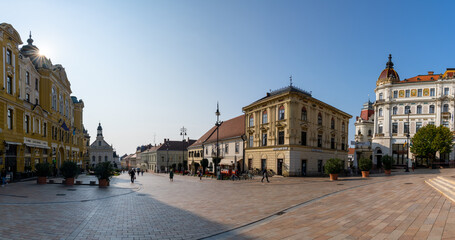 Poster - downtown Pécs and the Szechenyi Square with a sunburst