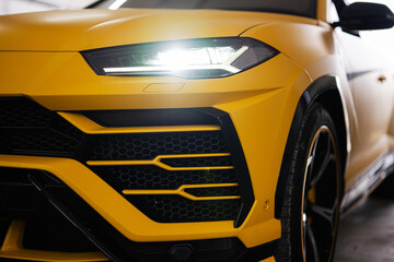 Headlights of yellow sport car suv.