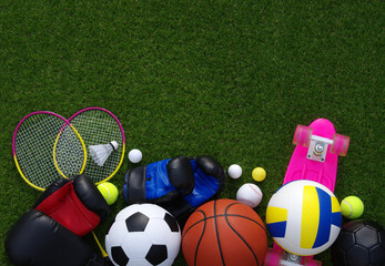 Wall Mural - Sports equipment on green grass