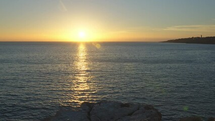 Wall Mural - Beautiful evening sunset in the Atlantic Ocean at Portugal coast. 