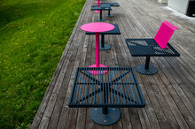 Colorful Metal Benches And Tables On The Terrace On A Sunny Summer Day