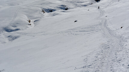 Wall Mural - a trail in the snow a beautiful sunny day in the winter snowy mountains