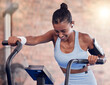 © D Theron/peopleimages.com - Fitness, woman and intense cycling at the gym for exercise, workout or healthy cardio training. Active female exercising on stationary bicycle or machine for health, wellness and endurance indoors