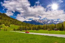 Red Porsche 911 997 In Alps Mountains, Davos, Graubuenden, Swit