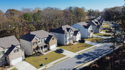 Wall Mural - Close-up aerial view new development two story houses with two car garage drive way in Flowery Branch, Georgia, USA