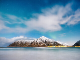 Wall Mural - norway, lofoten island. mountains and reflections on water at night. winter landscape. the sky with 