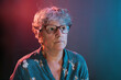 © ADDICTIVE STOCK - Elderly woman in glasses looking away