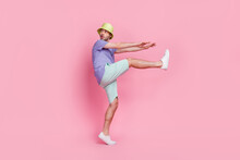 Full Size Photo Of Handsome Young Guy Look Back Empty Space Sneaking Danger Dressed Trendy Blue Garment Isolated On Pink Color Background