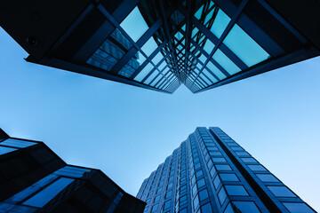 Looking up at modern skyscrapers in London, England.