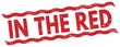 © outchill - IN THE RED text on red lines stamp sign.