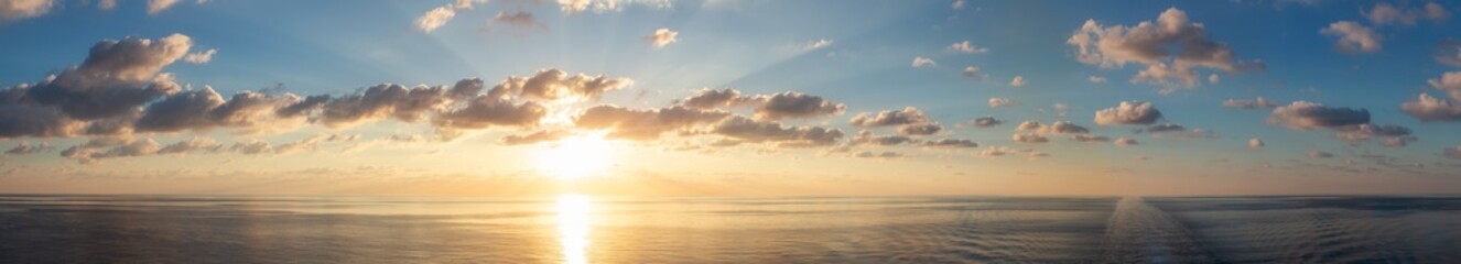 Wall Mural - Dramatic Colorful Sunrise Sky over Mediterranean Sea. Sky with Sunrays. Cloudscape Nature Background.